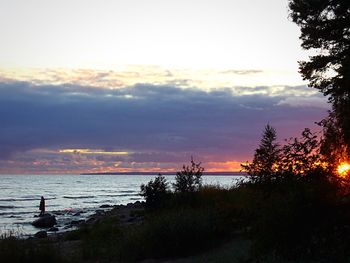 Scenic view of sea against sky at sunset