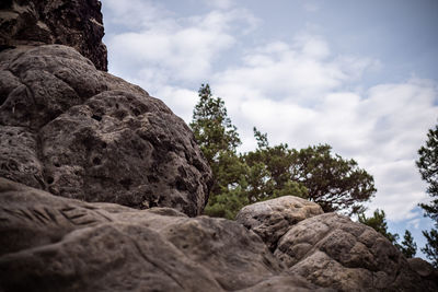 Low angle view of rocks against sky