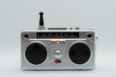 Close-up of telephone booth against white background