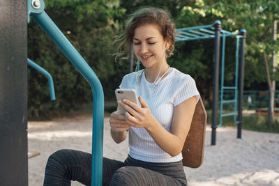 Young woman using mobile phone