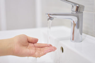 Midsection of man in bathroom