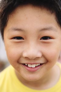 Close-up portrait of smiling boy