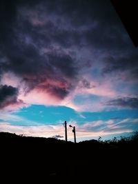 Silhouette of landscape against dramatic sky