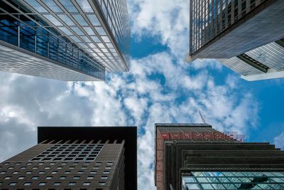 Low angle view of modern buildings against sky