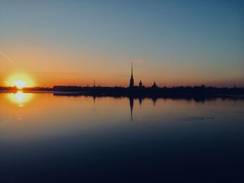 Scenic view of lake against sky during sunset