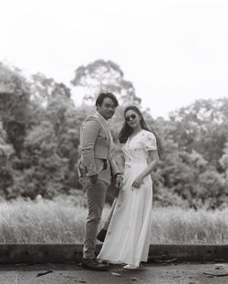 Portrait of a young couple standing outdoors