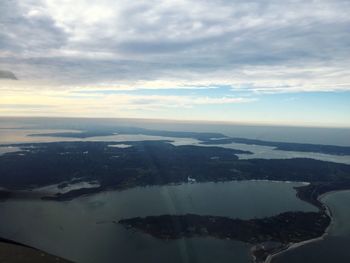 Scenic view of sea against cloudy sky