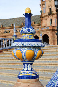 Close-up of statue against building