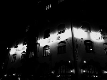 Low angle view of illuminated building at night