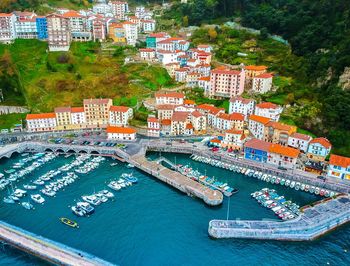 High angle view of sea amidst buildings in city