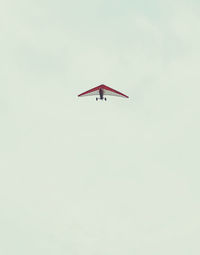 Low angle view of airplane flying in sky