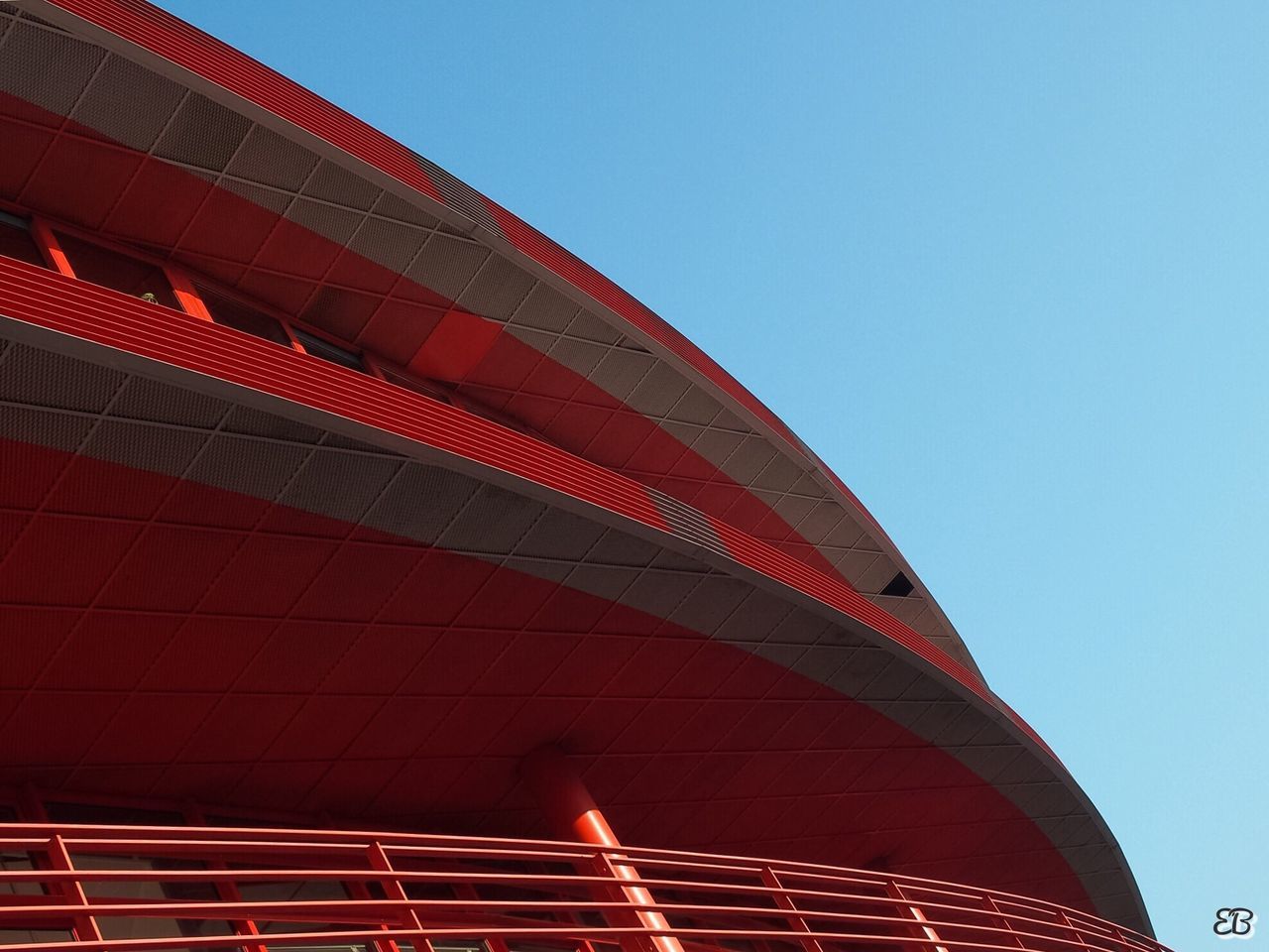 HIGH SECTION OF BUILDING AGAINST CLEAR BLUE SKY