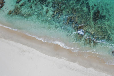 High angle view of surf on beach