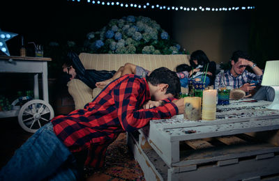 Young friends during party in backyard at night