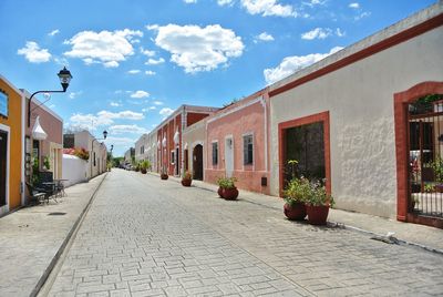 Street amidst buildings against sky