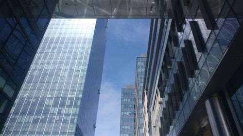 Low angle view of modern buildings against sky