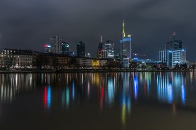 Illuminated city at waterfront