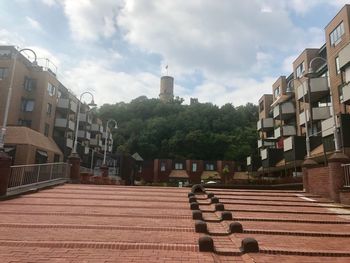 Street amidst buildings against sky