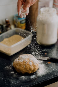 Close-up of person preparing food in kitchen