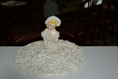 Close-up of white statue on table