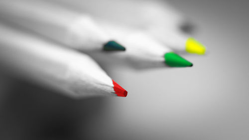 Close-up of colored pencils on white background