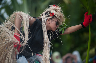 Low section of woman with girl wearing mask