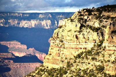 Scenic view of sea and mountain against sky