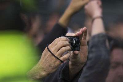 Close-up of man holding hands