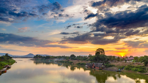 Scenic view of lake against sky during sunset