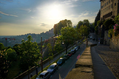 Street amidst buildings in city against sky