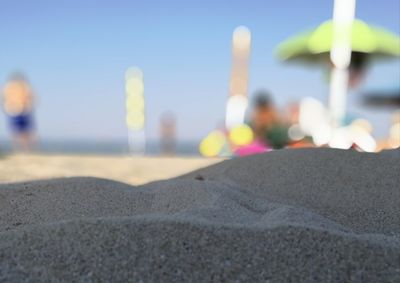 Close-up of sand against clear sky