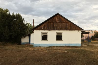 House on field against sky