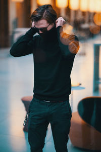 Young man standing outdoors