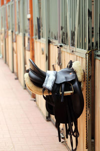 Close-up of clothes hanging on wall by footpath