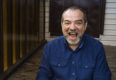 Portrait of smiling man standing outdoors
