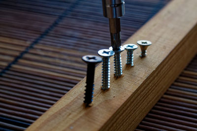 Close-up of screws in wood