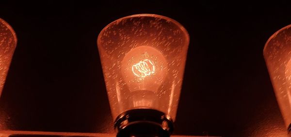 Close-up of illuminated light bulb