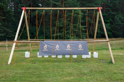 Text on swing in park