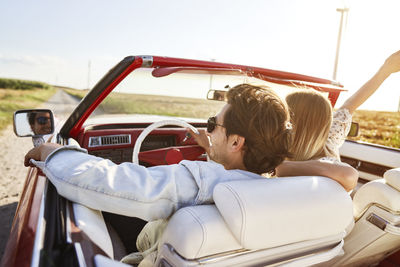 People sitting in car