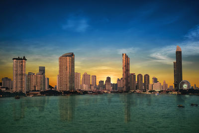 Bangkok's evening business city in thailand and the river is the center.