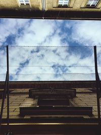 Low angle view of steps against blue sky