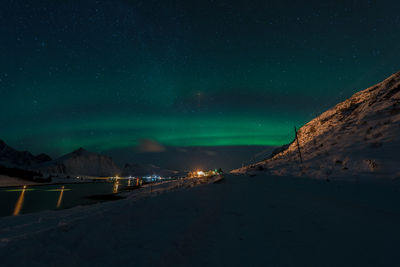 Scenic view of road against clear sky at night