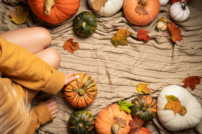 High angle view of pumpkins and vegetables