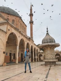 Girl and birds in sacred place