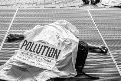 Rear view of woman standing by railing