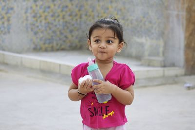 Portrait of cute girl standing outdoors