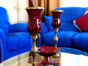 Close-up of wine glasses on table