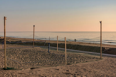 Scenic view of beach against sky during sunset