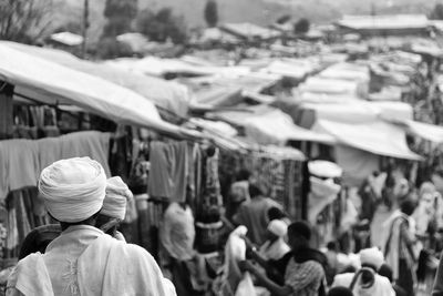 Rear view of people on street in city