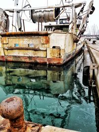 Boats moored at harbor